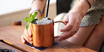 Woman having a refreshing drink with crushed ice in a bar closeup Popular Use 4